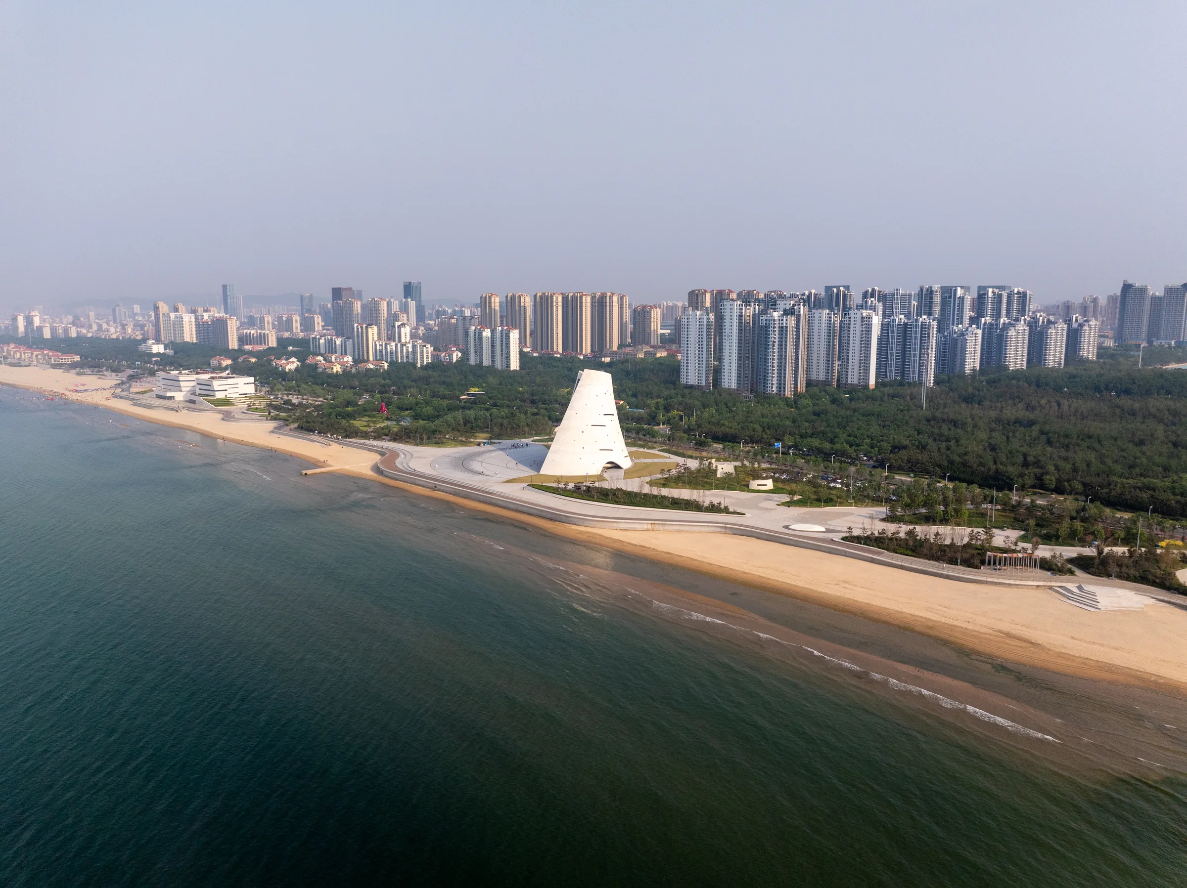 Aerial view of Yantai Golden Beach coastline and Sun Tower
